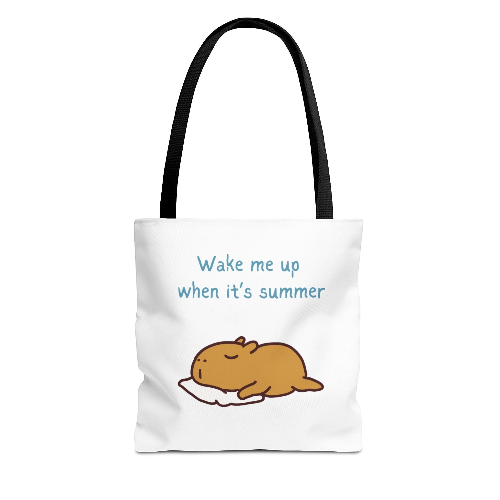 Capy Life white canvas tote bag featuring a cute illustration of a sleeping capybara and the text Wake me up when it's summer