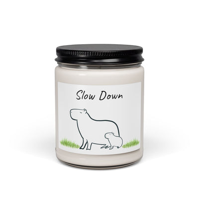 Capy Life Slow Down coconut cream scent soy wax candle in a reusable glass jar with a minimalist mother and baby capybara illustration.