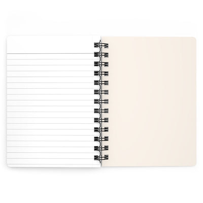 Capy Life spiral-bound notebook opened to show lined paper on the left and a blank cream page on the right.