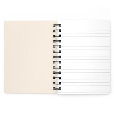 Capy Life spiral-bound notebook open to a blank cream-colored page and a lined page for writing.