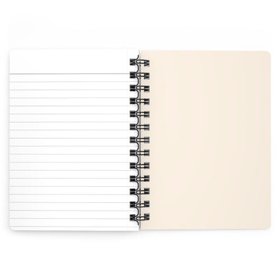 Capy Life spiral notebook open to show one lined page and one blank cream page with black wire binding