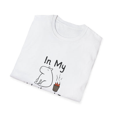 Capy Life white softstyle t-shirt featuring a hand-drawn capybara sitting calmly next to a small fire with text