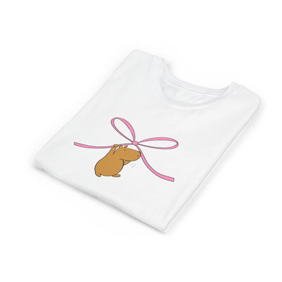 Capy Life white kids graphic tee featuring a cute brown capybara hanging from a pink coquette bow illustration.