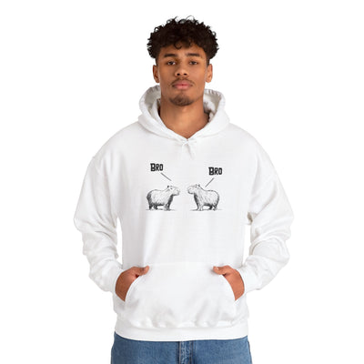 Capy Life white pullover hoodie featuring a funny sketch of two capybaras saying Bro, worn by a young man.