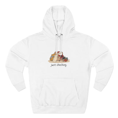 Capy Life white fleece hoodie featuring a funny hand-drawn capybara checking Santa's naughty-or-nice list.