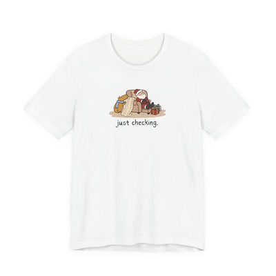 Capy Life white softstyle t-shirt featuring a hand-drawn capybara checking Santa's naughty or nice list.