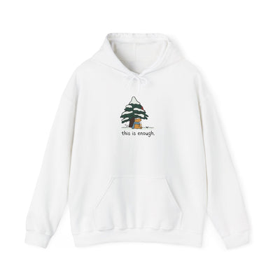 Capy Life white pullover hoodie featuring a graphic of a capybara under a snowy tree with the text this is enough