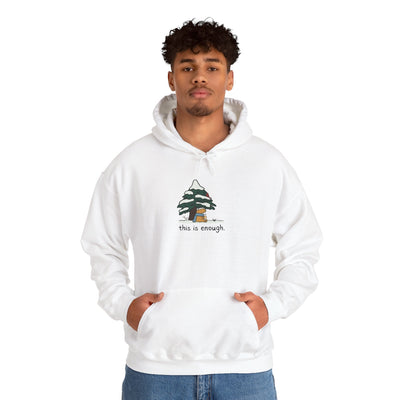 Capy Life white pullover hoodie featuring a graphic of a capybara under a snowy tree with the text this is enough
