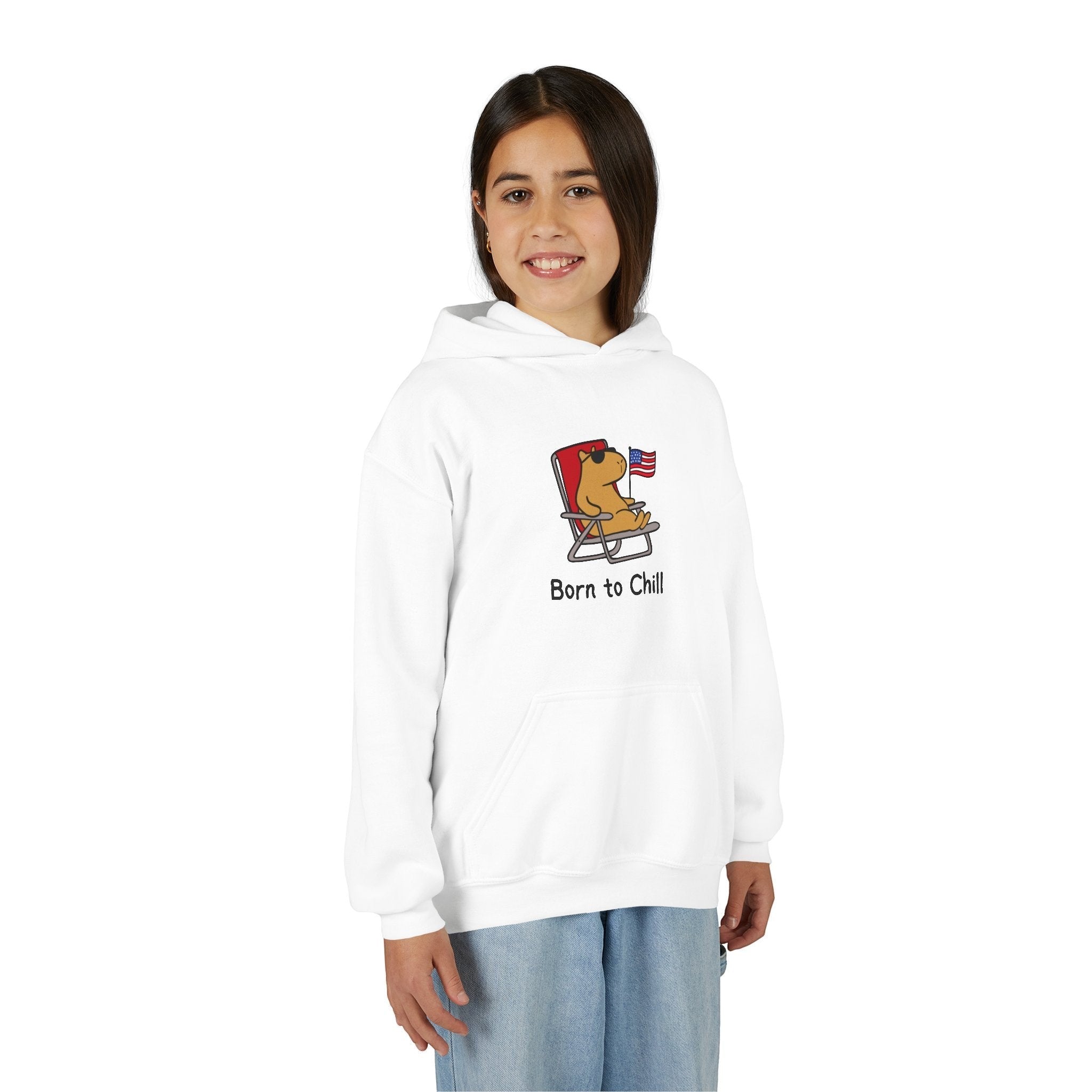 Capy Life youth white hoodie featuring a graphic of a capybara in a chair with an American flag and Born to Chill text