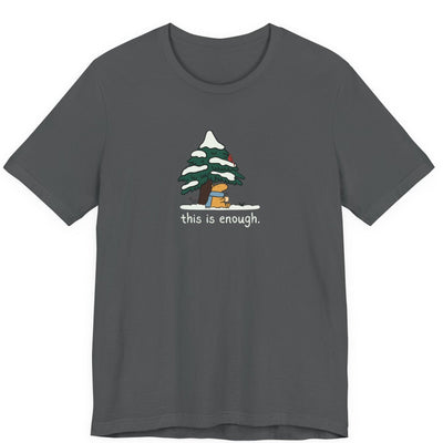 Capy Life dark grey graphic t-shirt featuring a capybara in a blue scarf under a snowy evergreen tree.