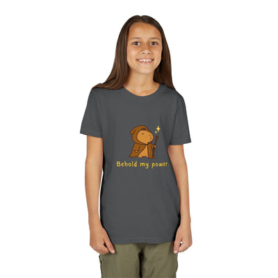 Girl wearing a dark grey Capy Life kids t-shirt featuring a cute wizard capybara graphic and Behold my power text