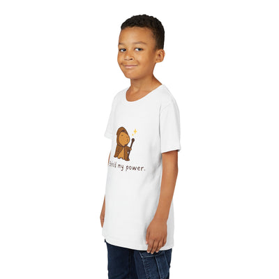 Young boy wearing a white Capy Life cotton t-shirt featuring a cute wizard capybara graphic and Behold My Power text.